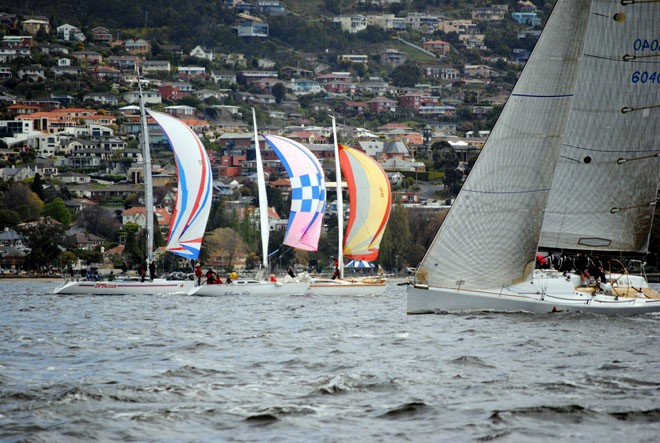Group 1 boats under spinnaker as a Farr 50 beats to windward on the Derwent. ©  Andrea Francolini Photography http://www.afrancolini.com/
